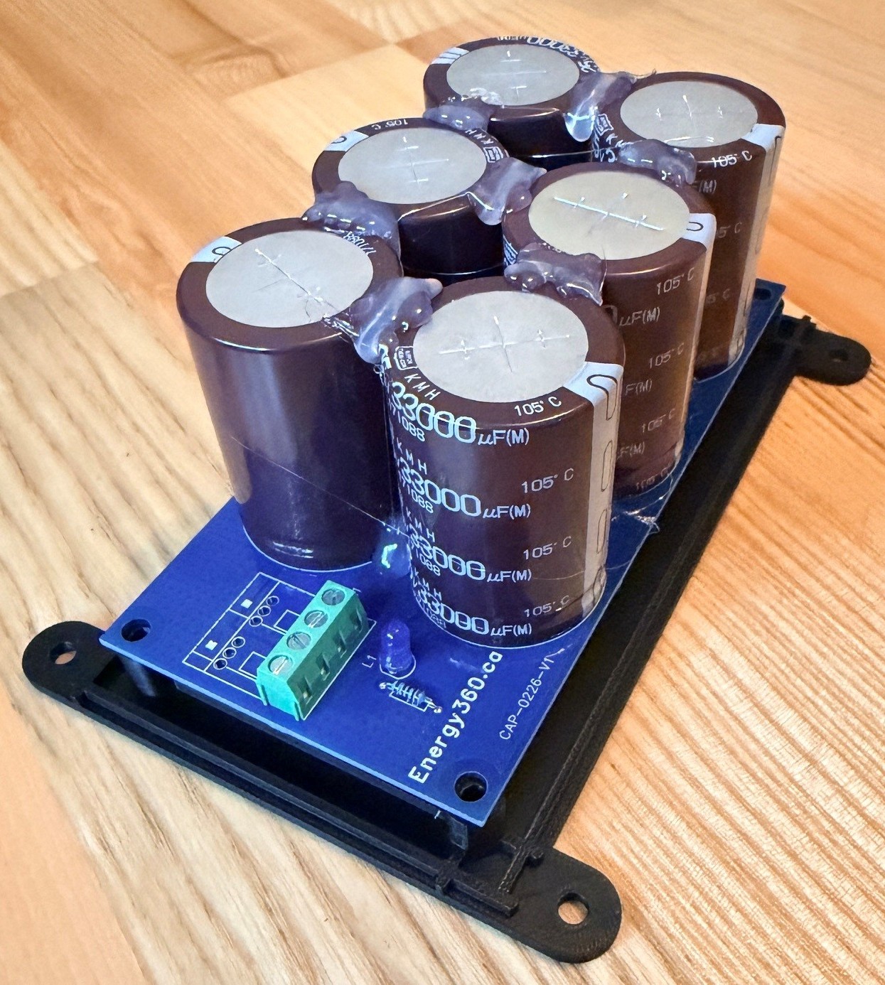 Energy360 capacitor bank installed on its black mounting frame