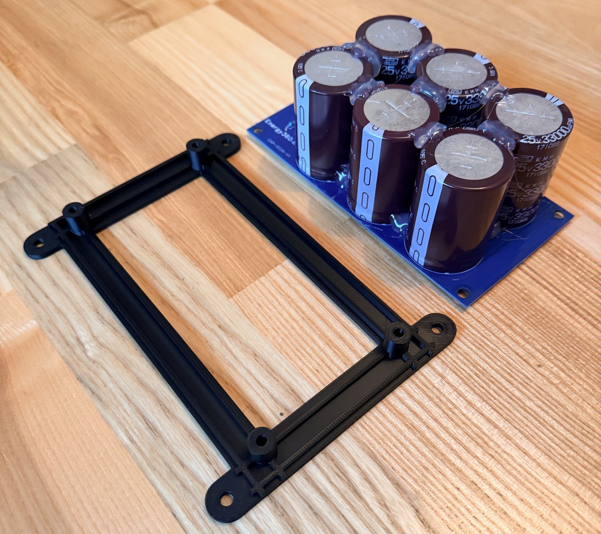 Capacitor bank and mounting frame shown side by side